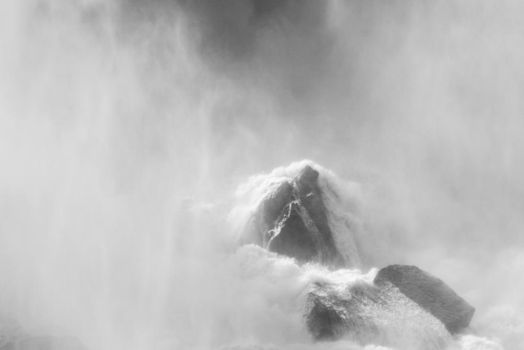 Mist from waterfall on rocks