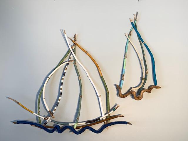 Large and small sailboat sticks and driftwood
