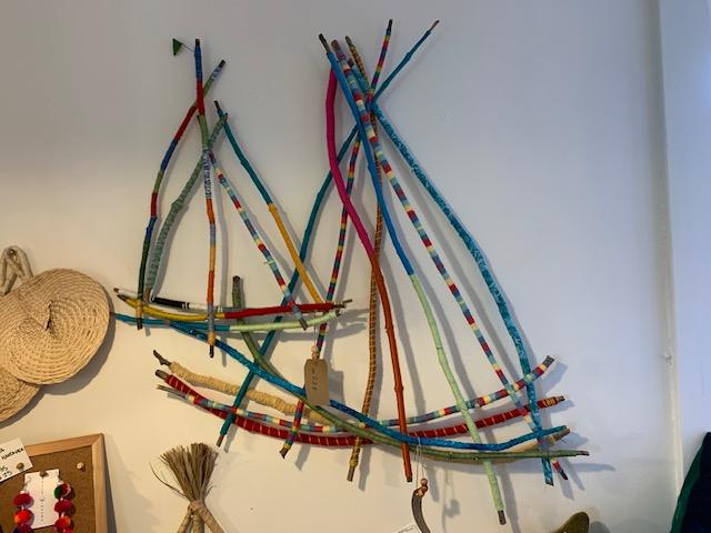2 stick sailboats covered with yarn and fabric