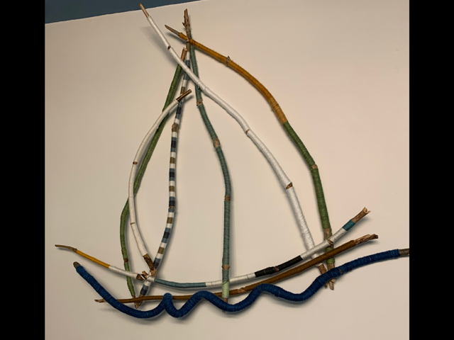 Large sailboat with sticks and drift wood