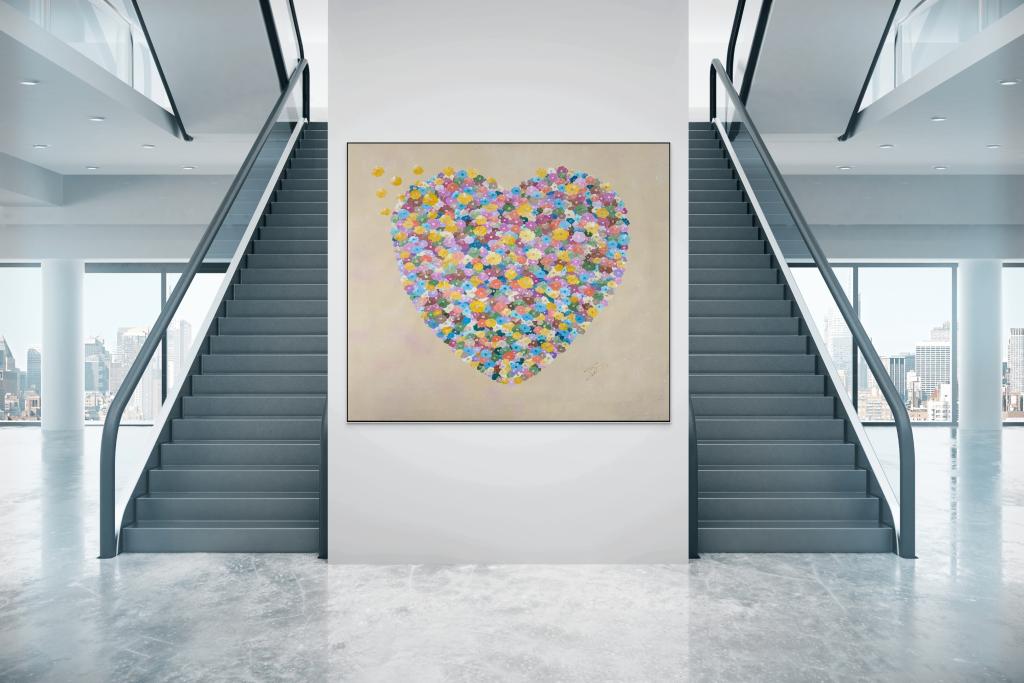 Large painting of floral heart in corporate setting